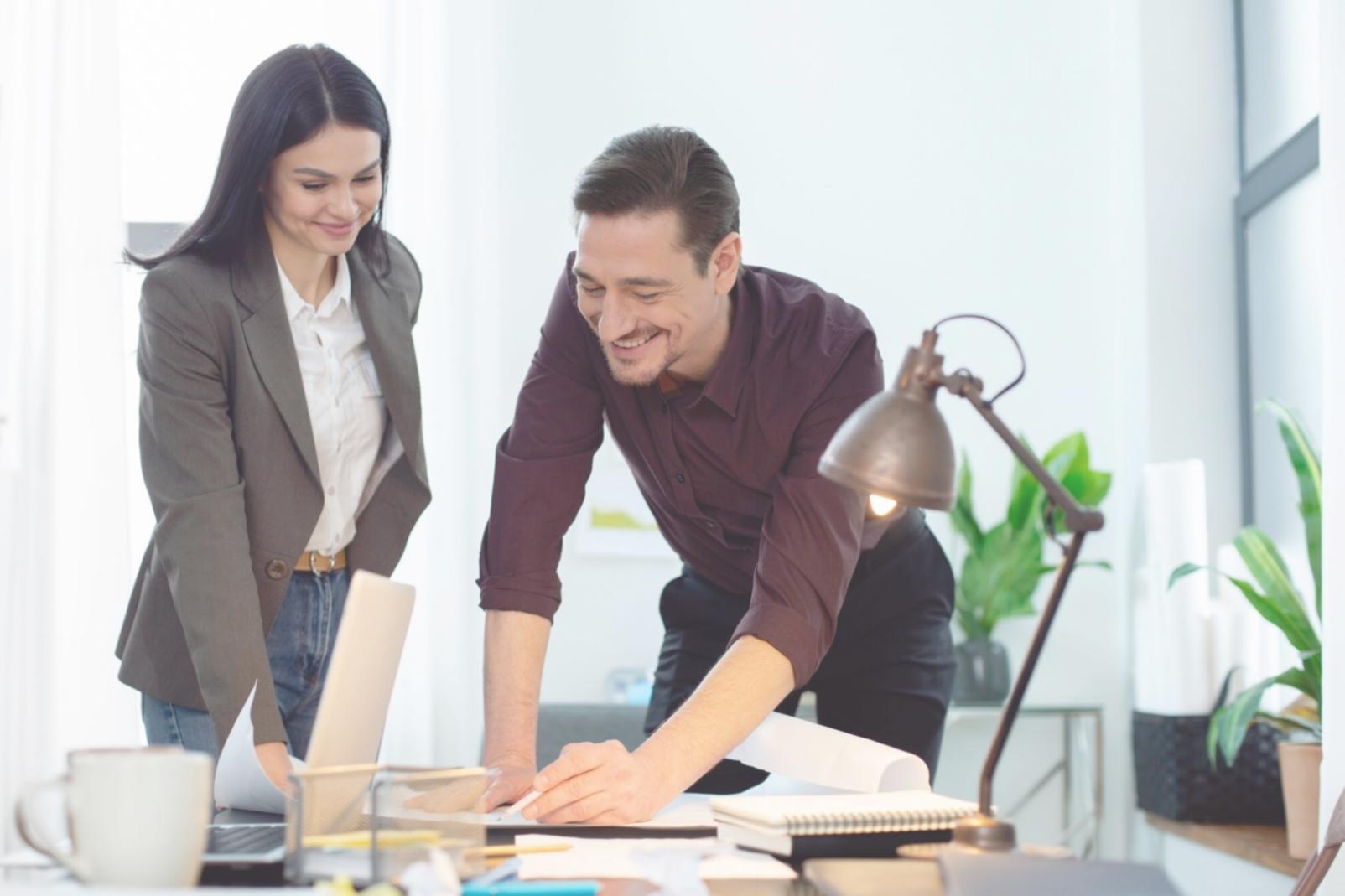 Person working on financial planning with documents and calculator